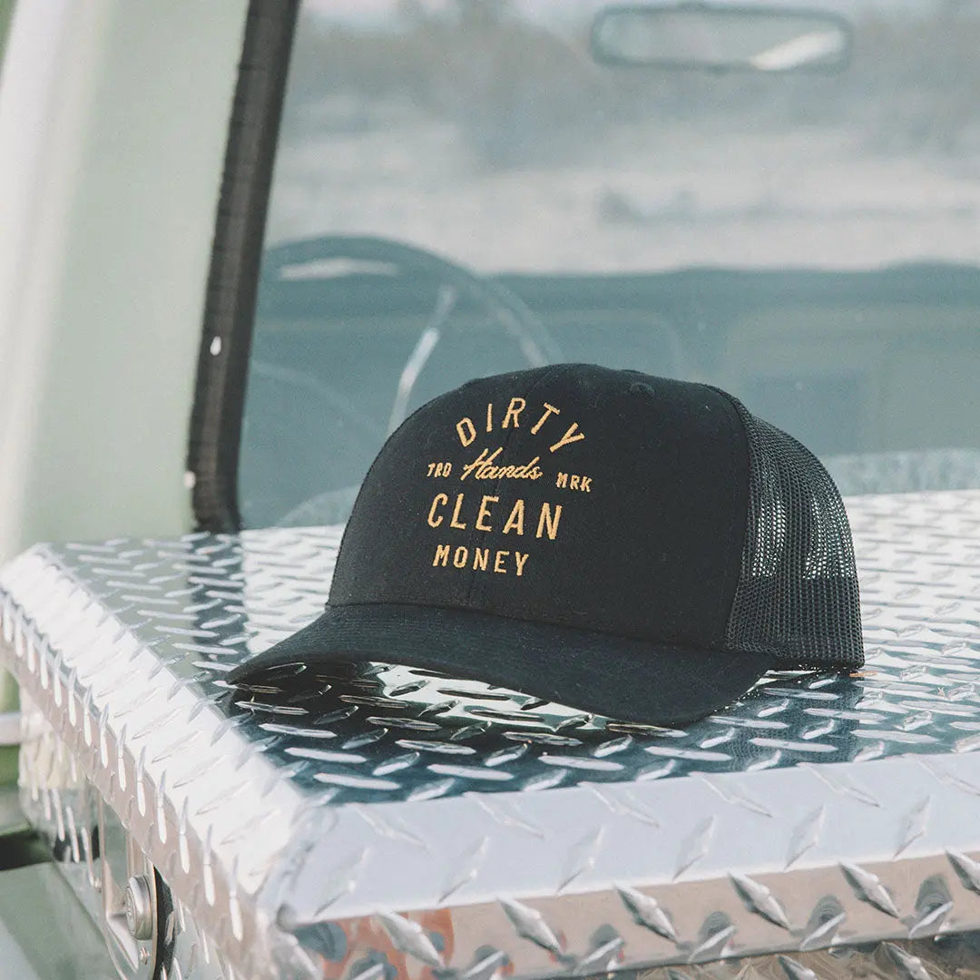 Juno curved brim hat with Dirty Hands Clean Money slogan